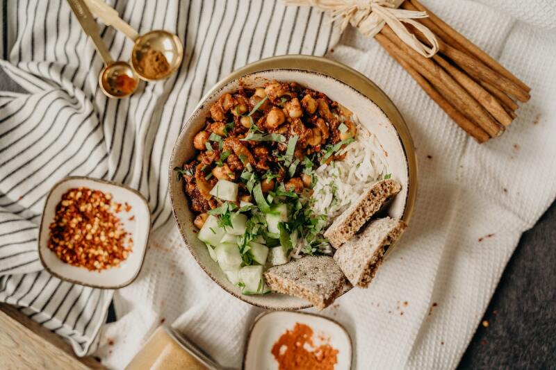 Close up of a vegan chili bowl on tablecloths