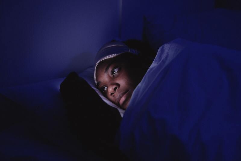 Person looking at their phone at night