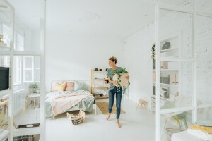 Girl moving into a new bedroom after graduating college