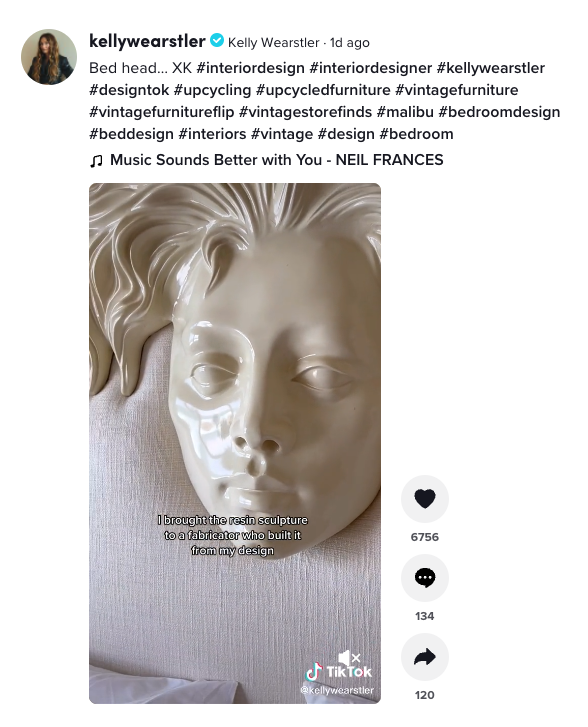 screen shot of a TikTok of designer Kelly Wearstler's headboard, with a resin statue of a woman's face