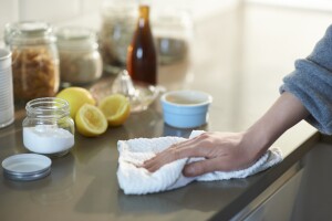 Wiping counter top with natural cleaning products