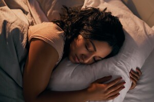 Woman sleeping peacefully after practicing PMR, progressive muscle relaxation